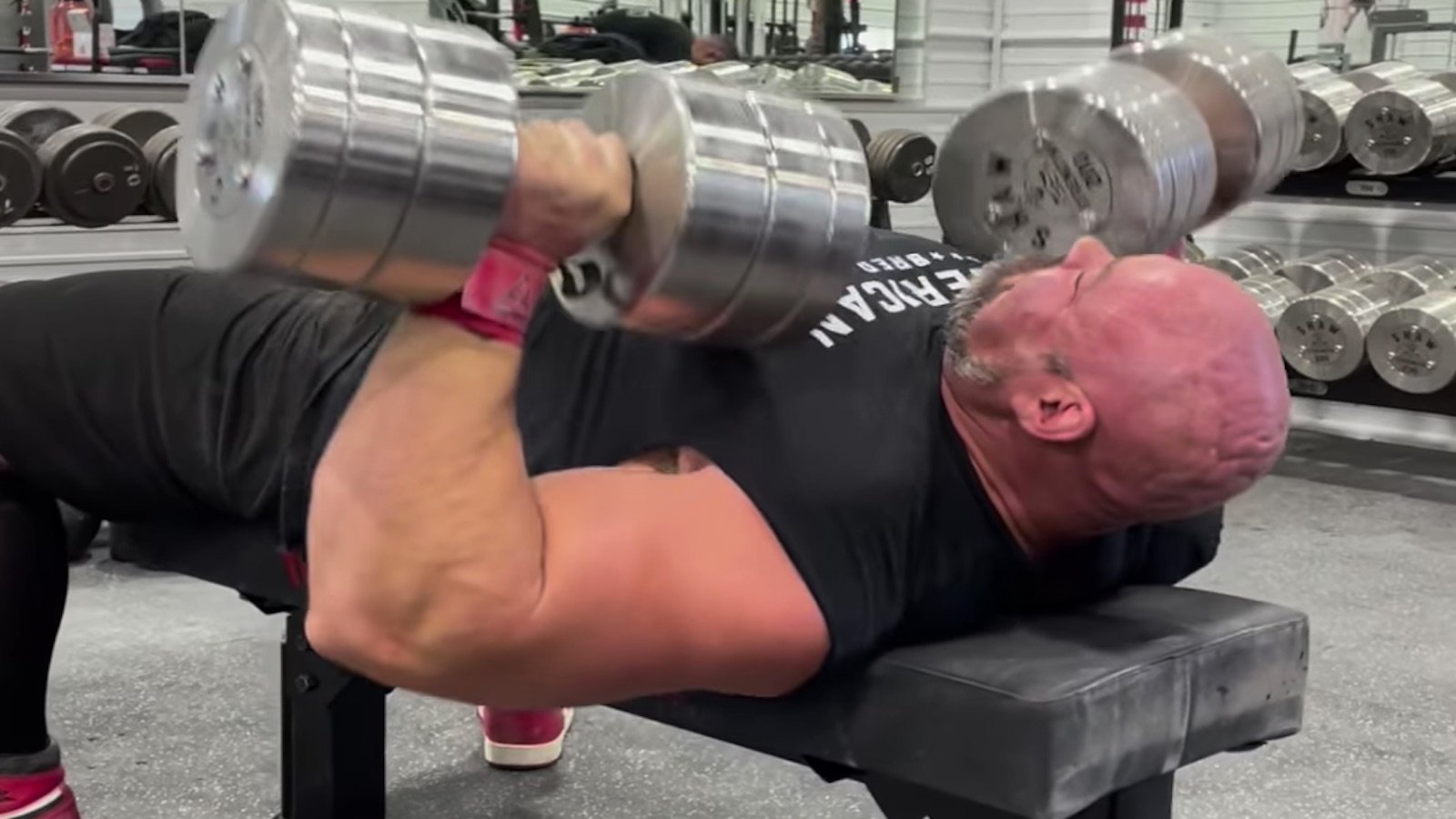 brian-shaw-benches-91-kilogram-(200-pound)-dumbbells-for-5-fast-reps-before-his-final-strongman-contest-–-breaking-muscle